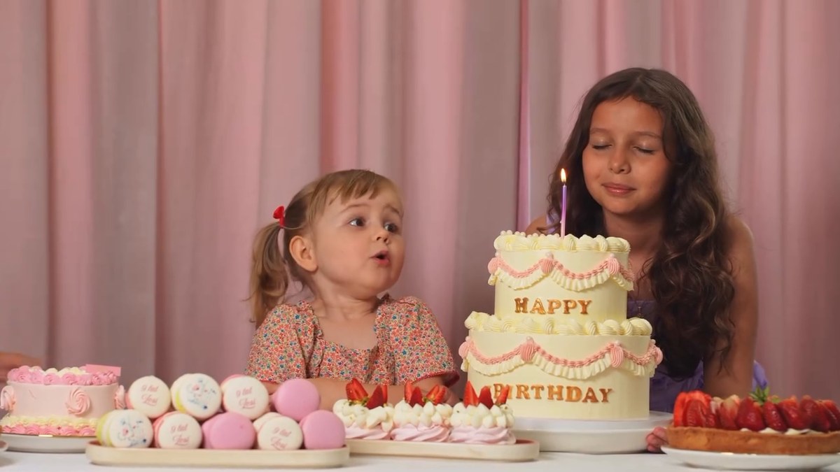 Kira and a young co-star in the A. Blikle birthday campaign