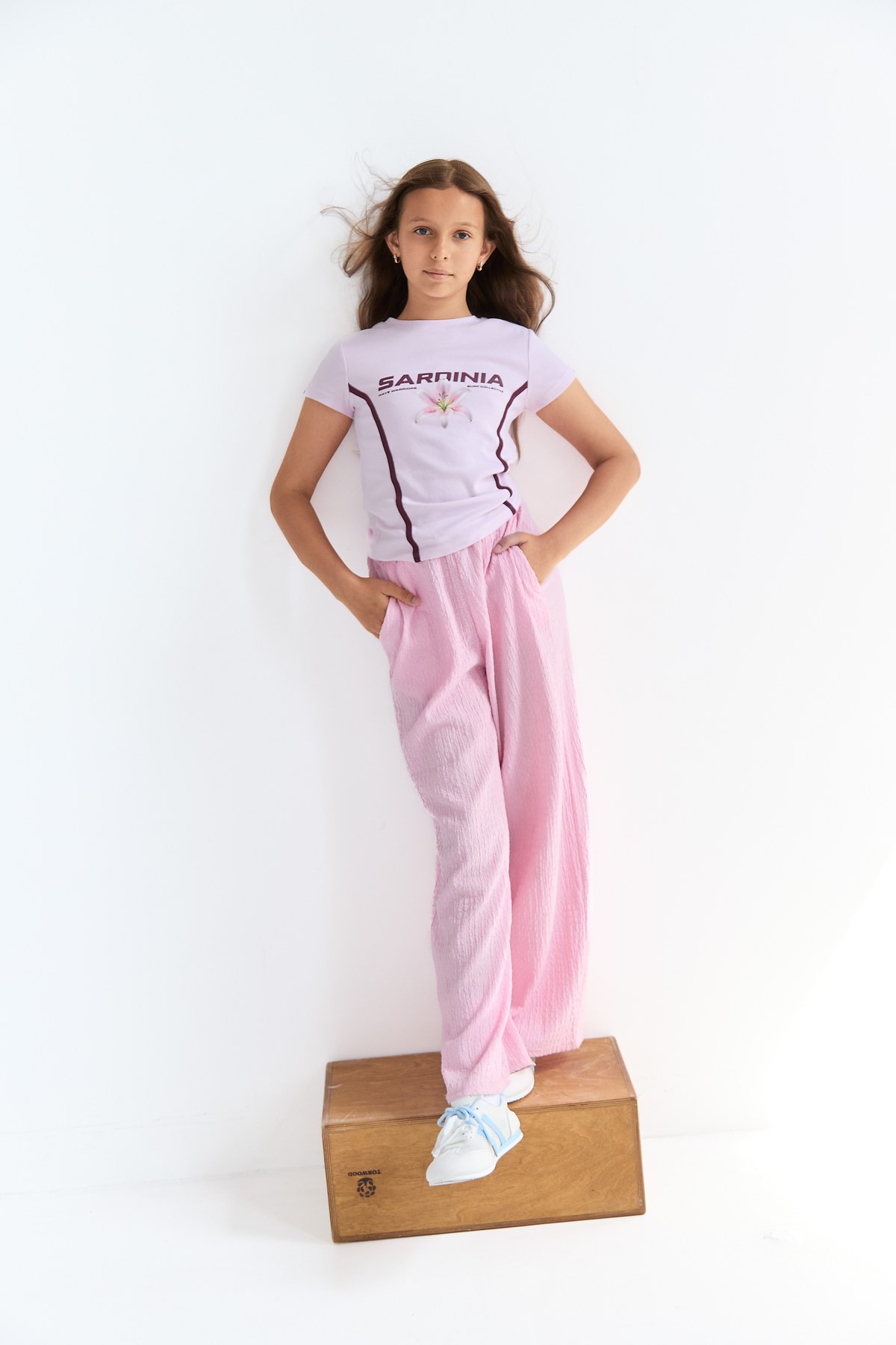 Soft pink editorial portrait with natural movement