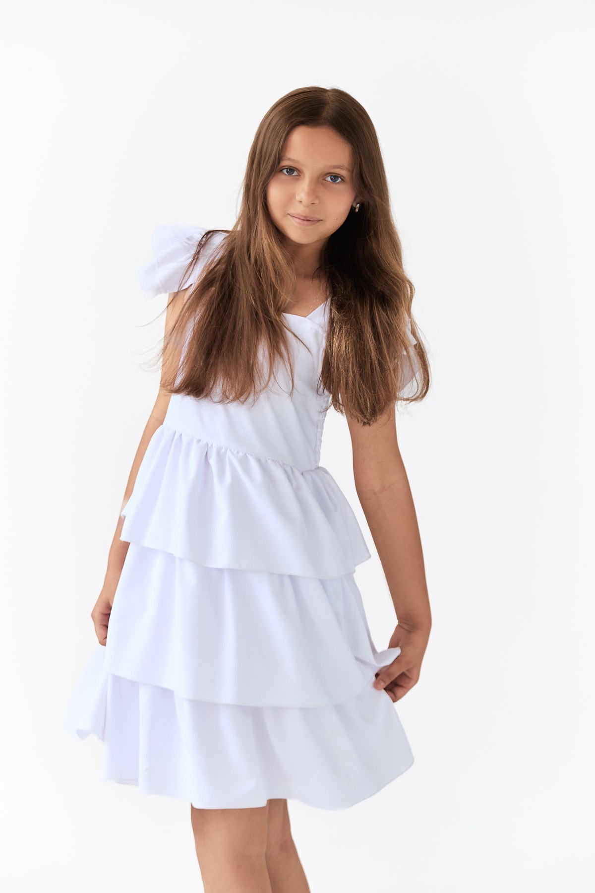 Natural commercial portrait in a light summer dress